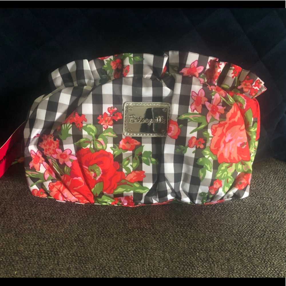 Brand new with tags Betsy Johnson wristlet.